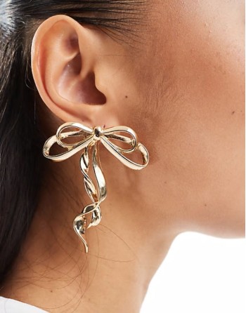 oversized stud earrings with bow detail in gold tone
