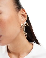 oversized stud earrings with bow detail in gold tone