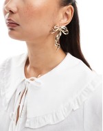 oversized stud earrings with bow detail in gold tone