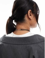 Curve necklace with multirow molten pendant and cord design in silver tone