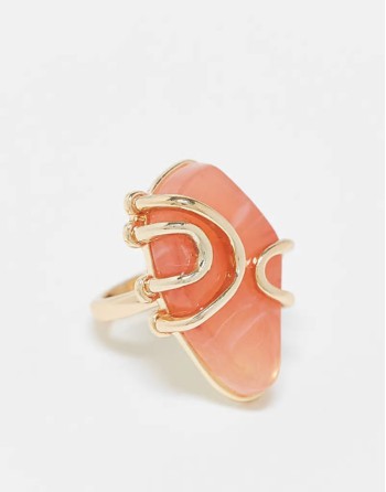 Curve ring with faux semi precious pink stone in gold tone