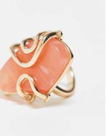 Curve ring with faux semi precious pink stone in gold tone