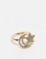 ring with star and moon design in gold tone