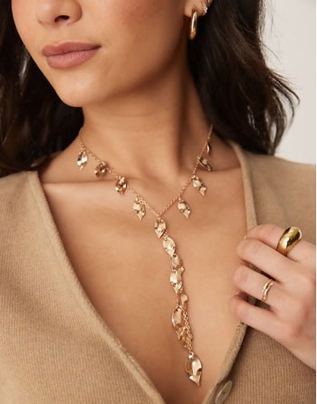lariat necklace with leaf detail in worn gold