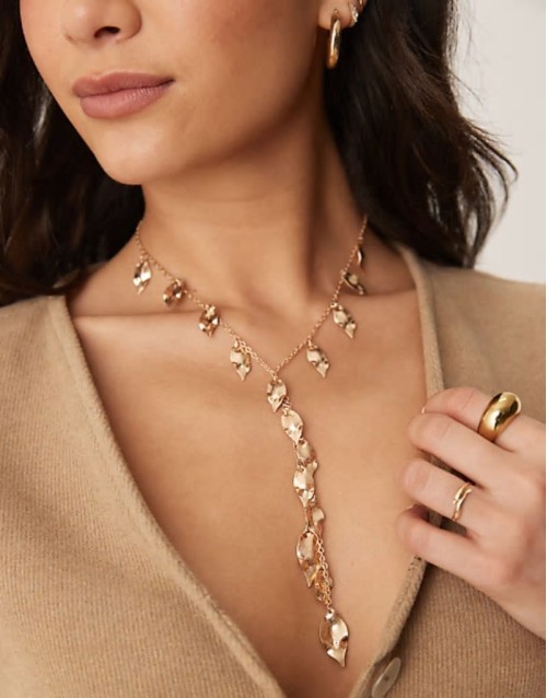 lariat necklace with leaf detail in worn gold