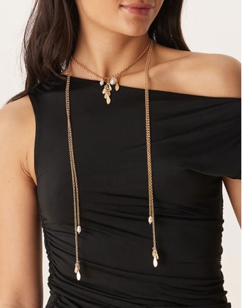 multirow necklace with long tassel detail in gold tone
