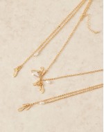 multirow necklace with long tassel detail in gold tone